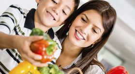 mom and son choose vegetables