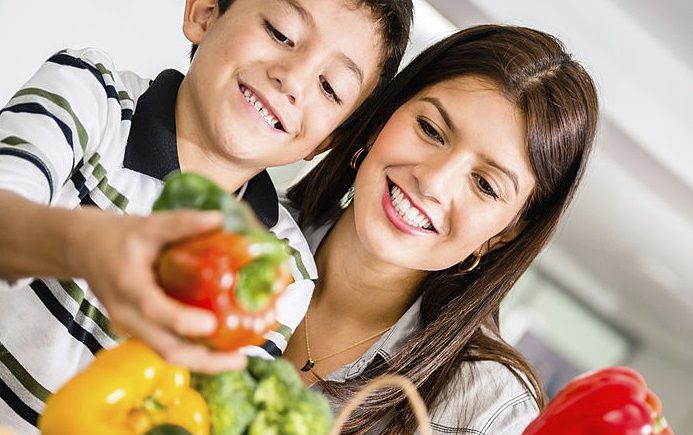 mom and son choose vegetables
