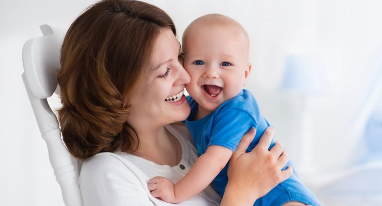 young mother snuggling baby