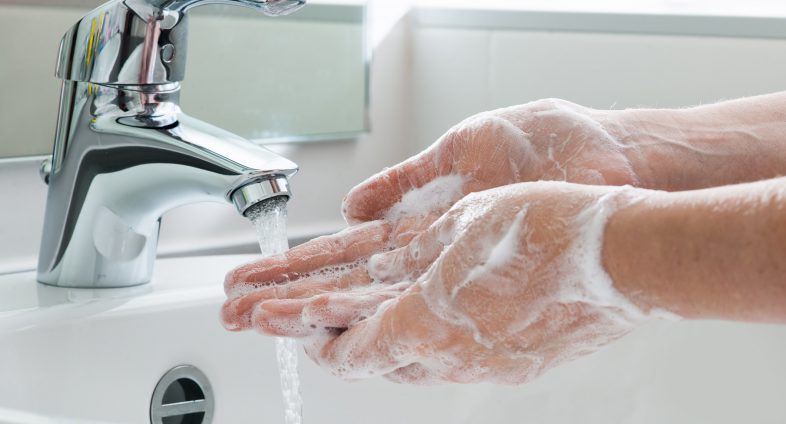 washing hands with soapy water