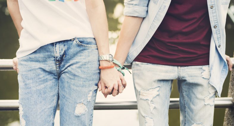 youth couple holding hands