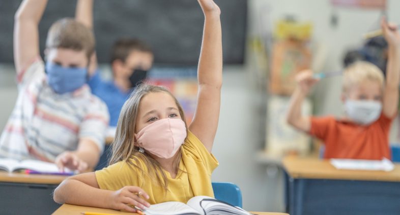 elementary students in class wearing face masks